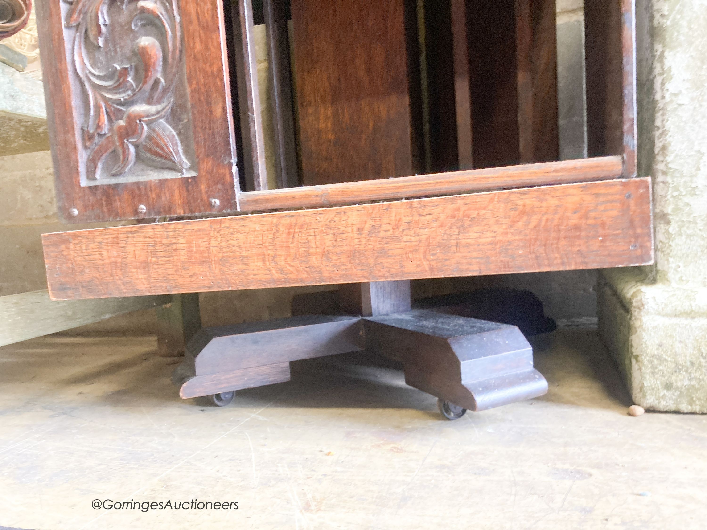 An early 20th century carved oak revolving bookcase, length 52cm, height 79cm